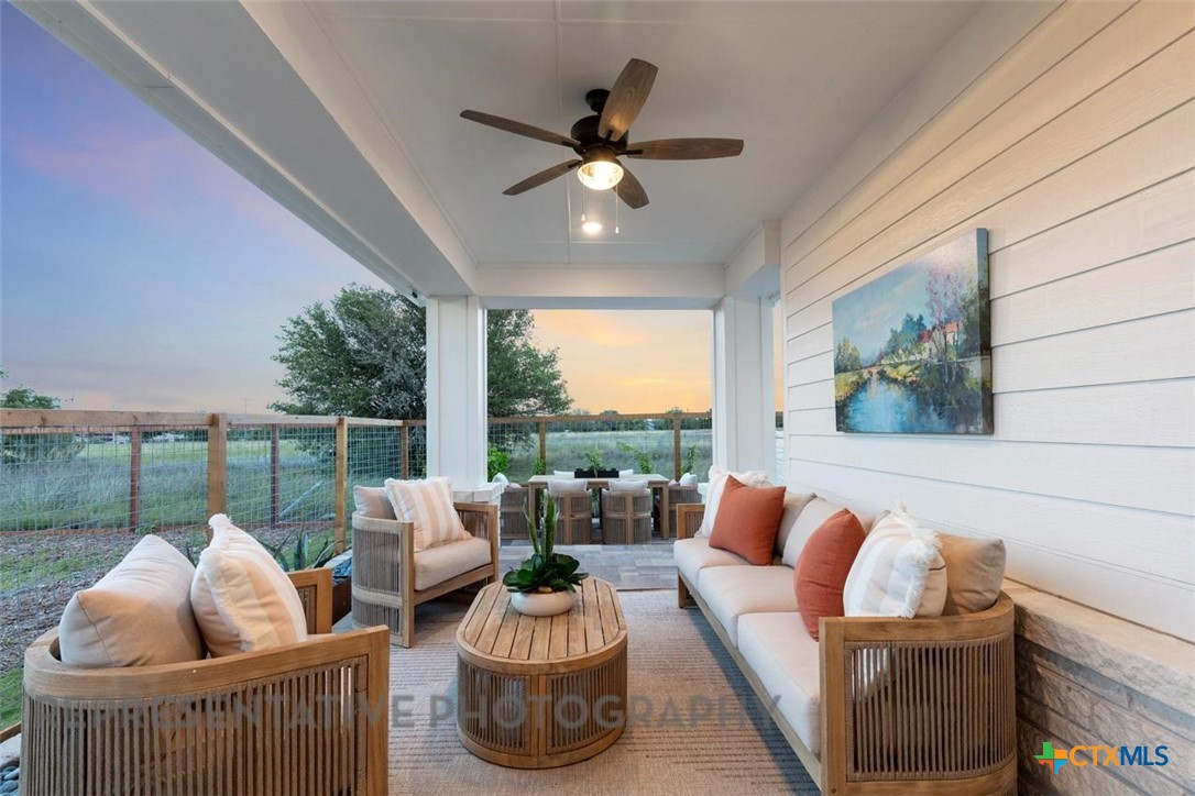 9501 Boathouse Drive Austin, TX 78744 - Photo 31 of 32 a living room with furniture and a floor to ceiling window