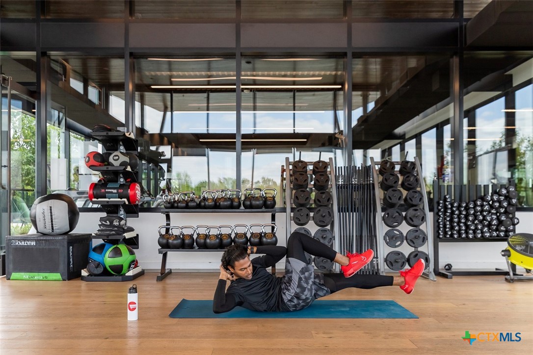 9501 Boathouse Drive Austin, TX 78744 - Photo 9 of 32 a view of a garage with lots of stuff