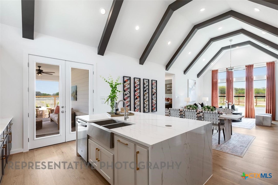 9501 Boathouse Drive Austin, TX 78744 - Photo 14 of 32 a large white kitchen with a large window