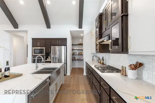 a bedroom with a bed a potted plant and a window