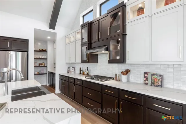 a spacious bathroom with sink shower and a bathtub