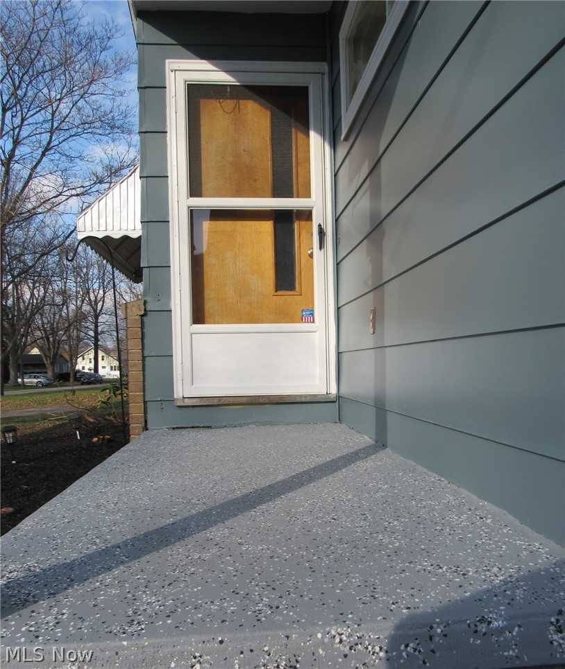 5910 Granger Road Ashtabula, OH 44004 - Photo 23 of 23 The front entrance welcomes you with recently painted concrete steps.