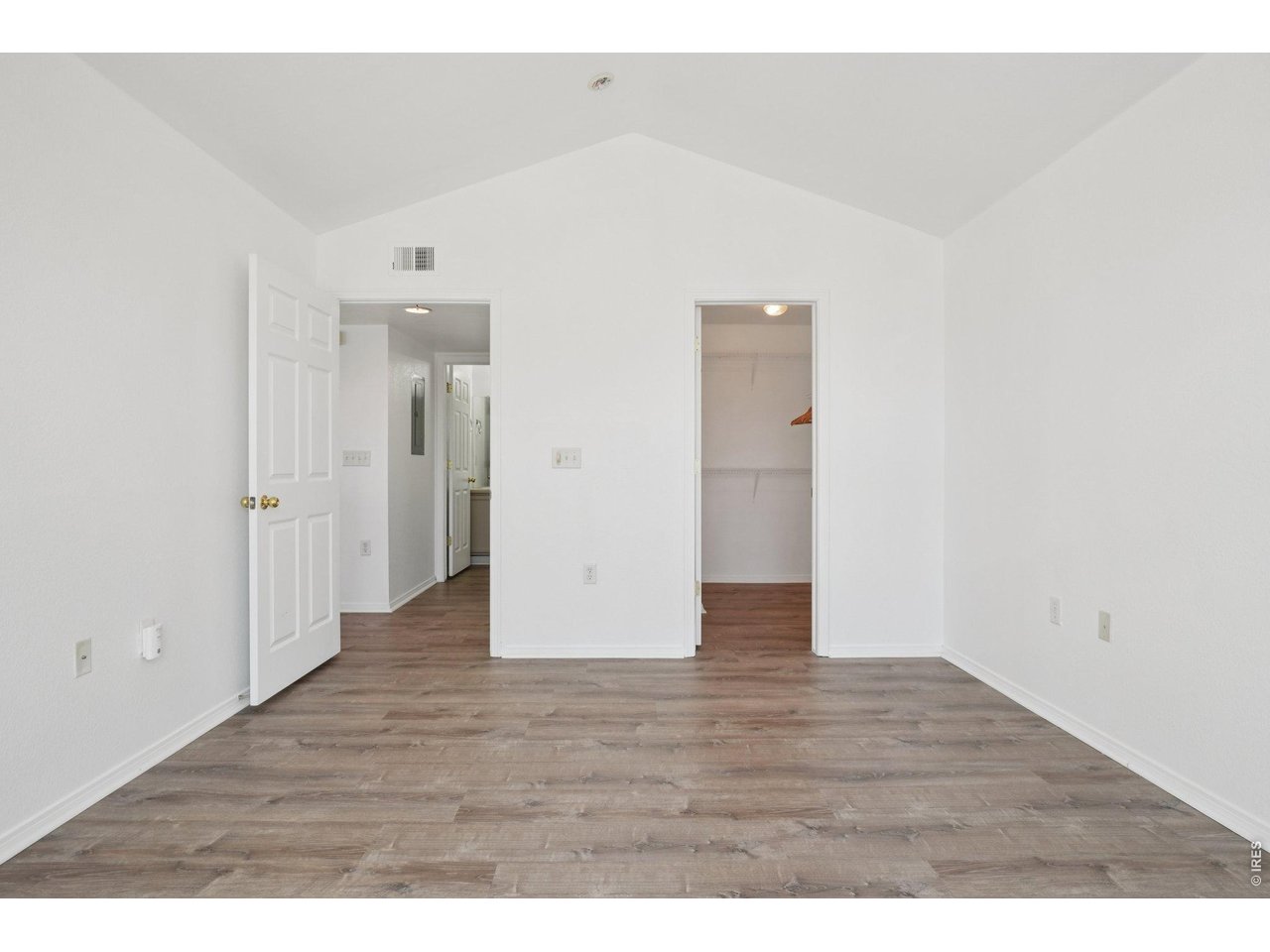 3002 West Elizabeth Street, Unit 16G Fort Collins, CO 80521 - Photo 17 of 29 a view of an empty room with wooden floor