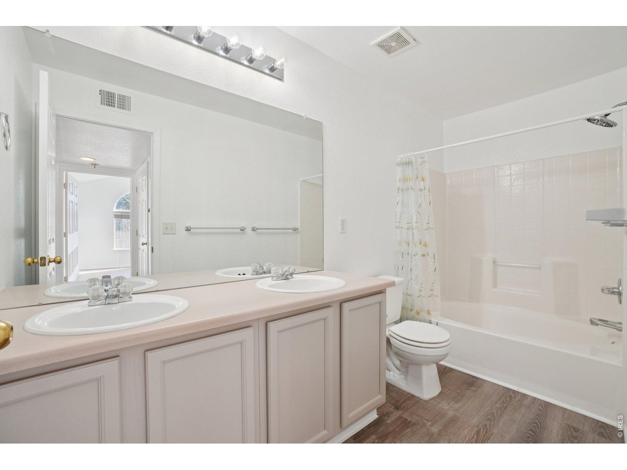 3002 West Elizabeth Street, Unit 16G Fort Collins, CO 80521 - Photo 20 of 29 a bathroom with a sink toilet a mirror and shower