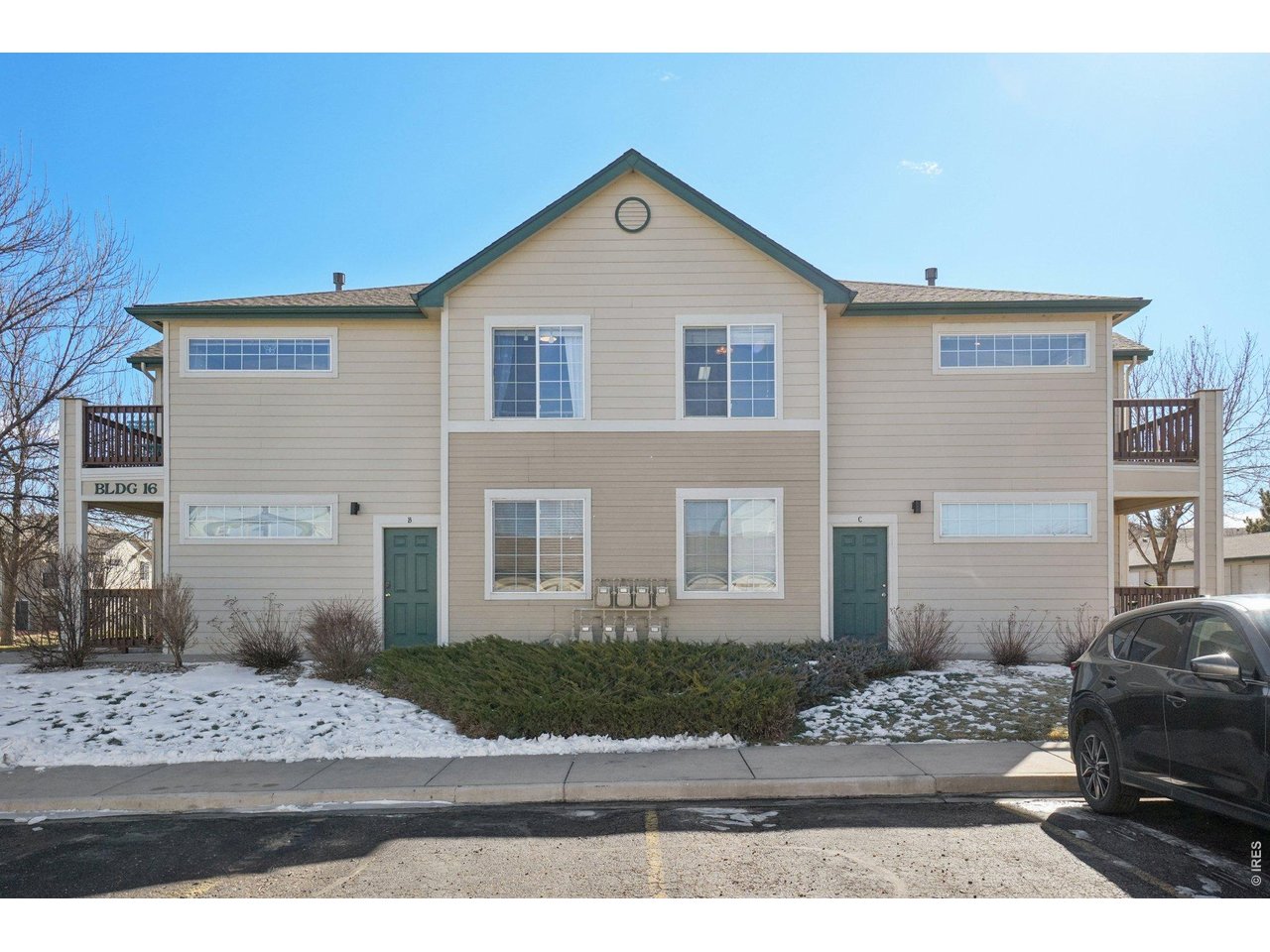 3002 West Elizabeth Street, Unit 16G Fort Collins, CO 80521 - Photo 25 of 29 a front view of a house with a yard