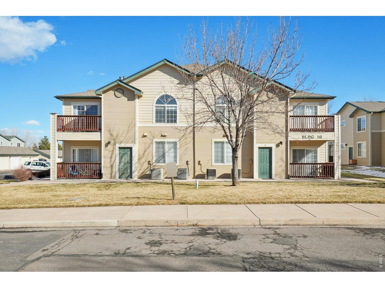3002 West Elizabeth Street, Unit 16G Fort Collins, CO 80521 - Photo 27 of 29 a view of a white house with a street view
