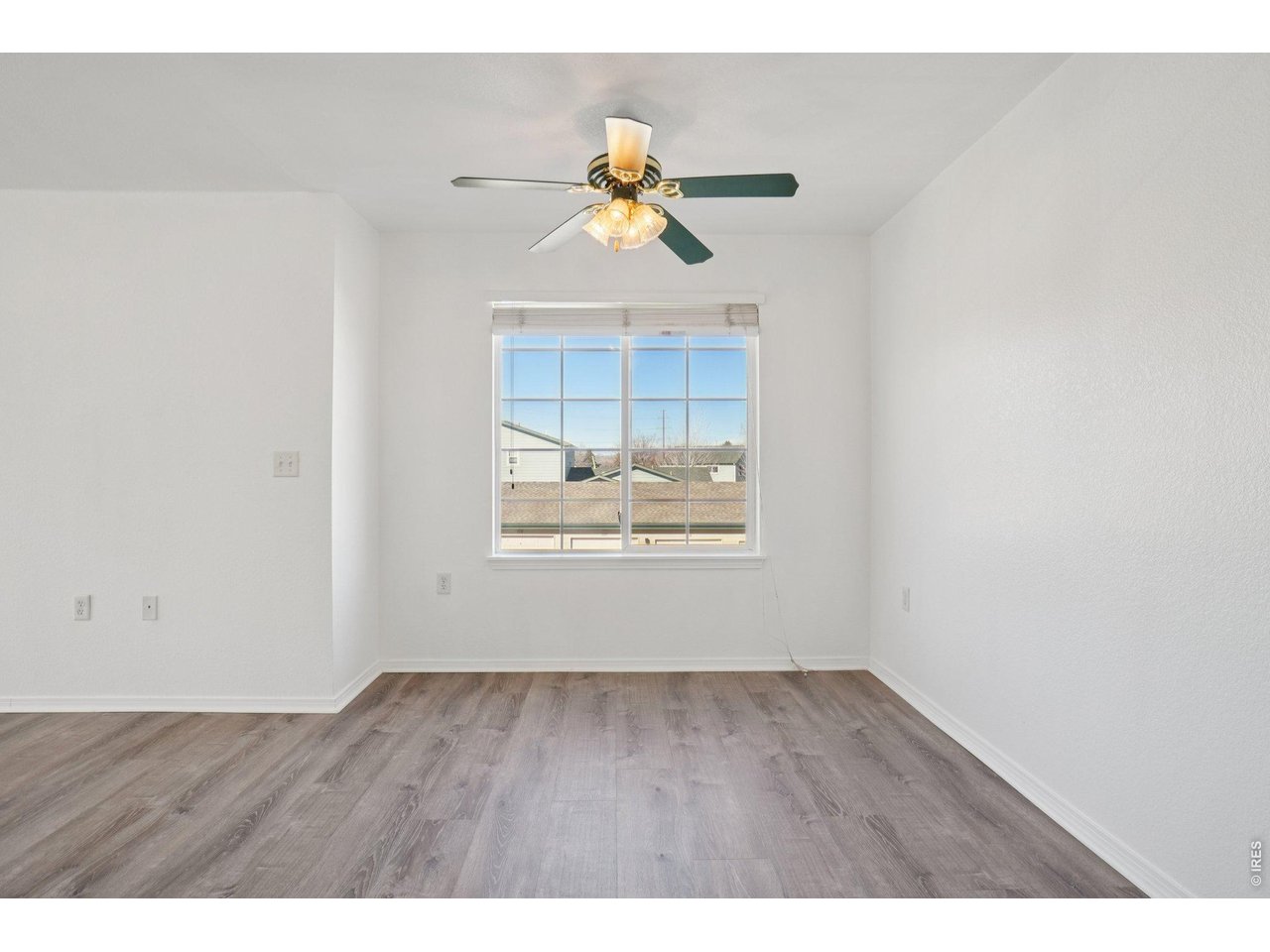 3002 West Elizabeth Street, Unit 16G Fort Collins, CO 80521 - Photo 10 of 29 a view of empty room with wooden floor