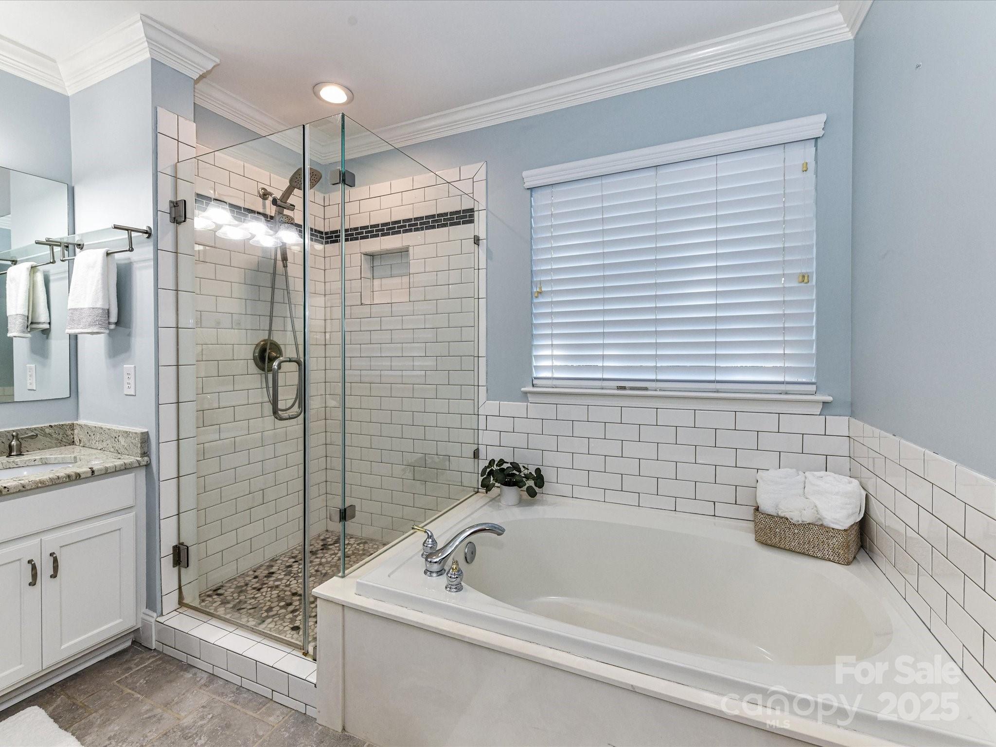 129 Shorecrest Drive Davidson, NC 28036 - Photo 27 of 45 a bathroom with a tub a sink and shower