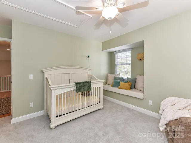 a view of a bedroom with furniture and windows