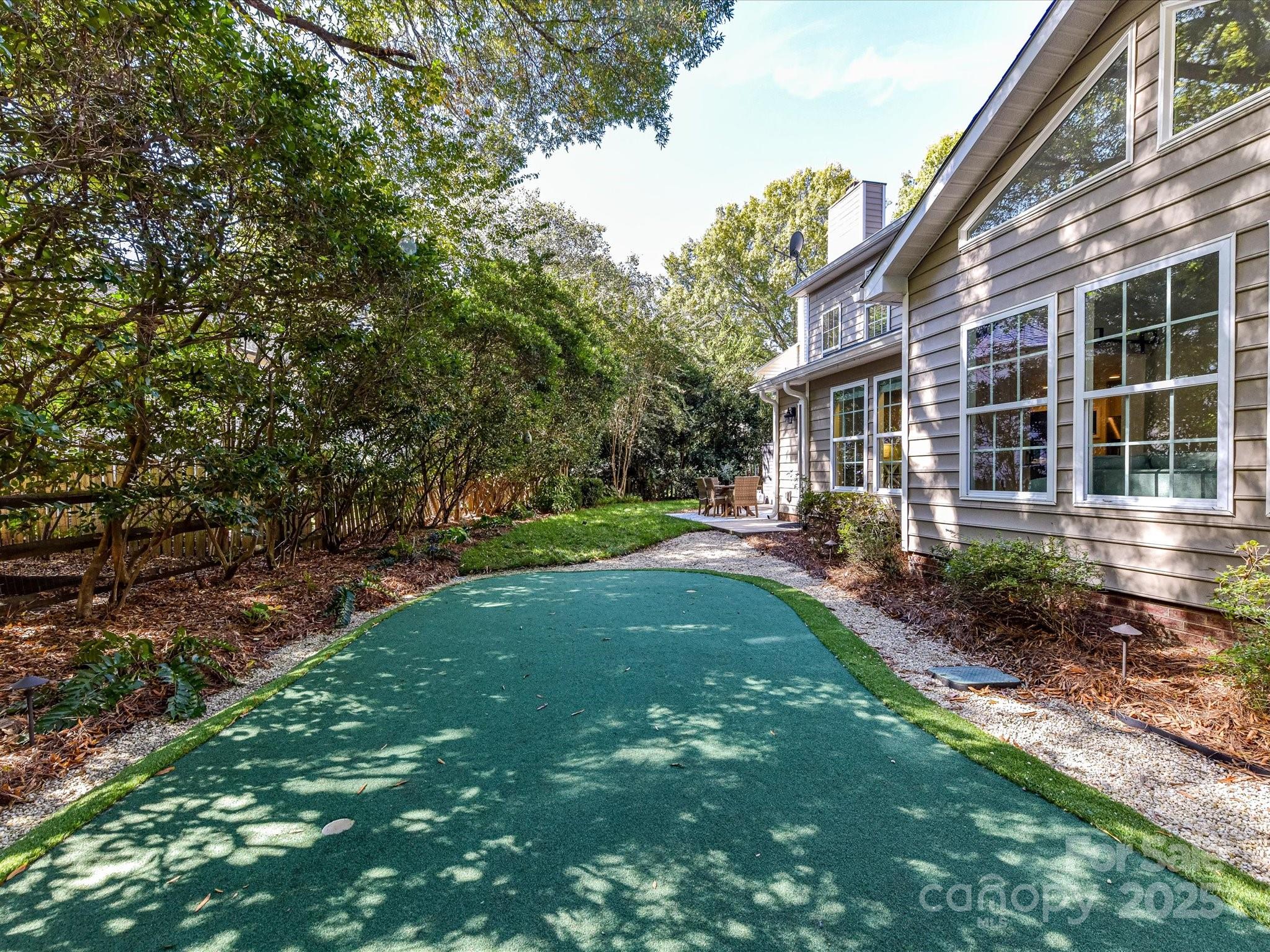 129 Shorecrest Drive Davidson, NC 28036 - Photo 38 of 45 a view of a patio with table and chairs and potted plants