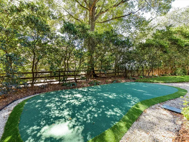 a view of park with large trees