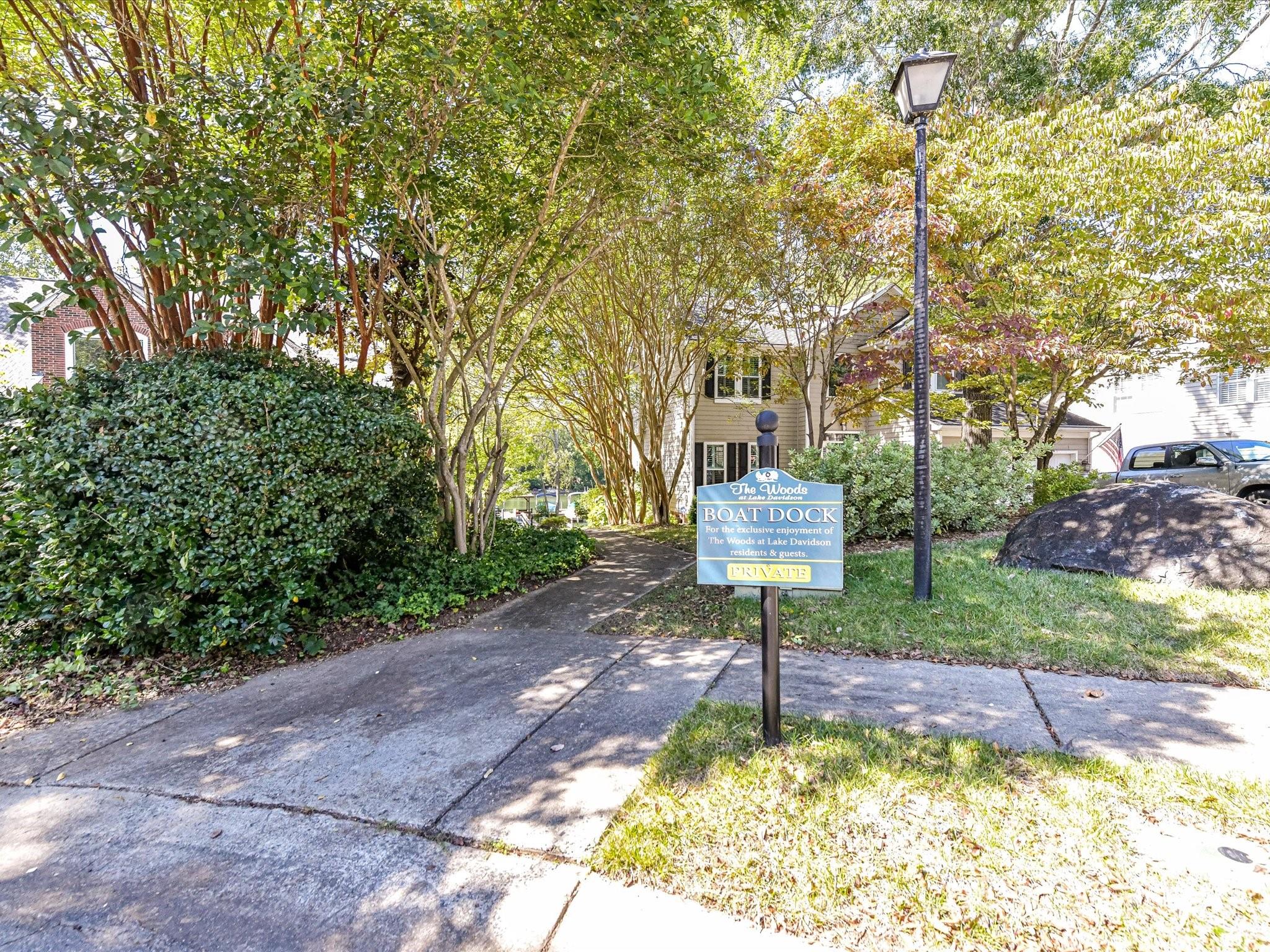 129 Shorecrest Drive Davidson, NC 28036 - Photo 40 of 45 a front view of a house with a yard and fountain