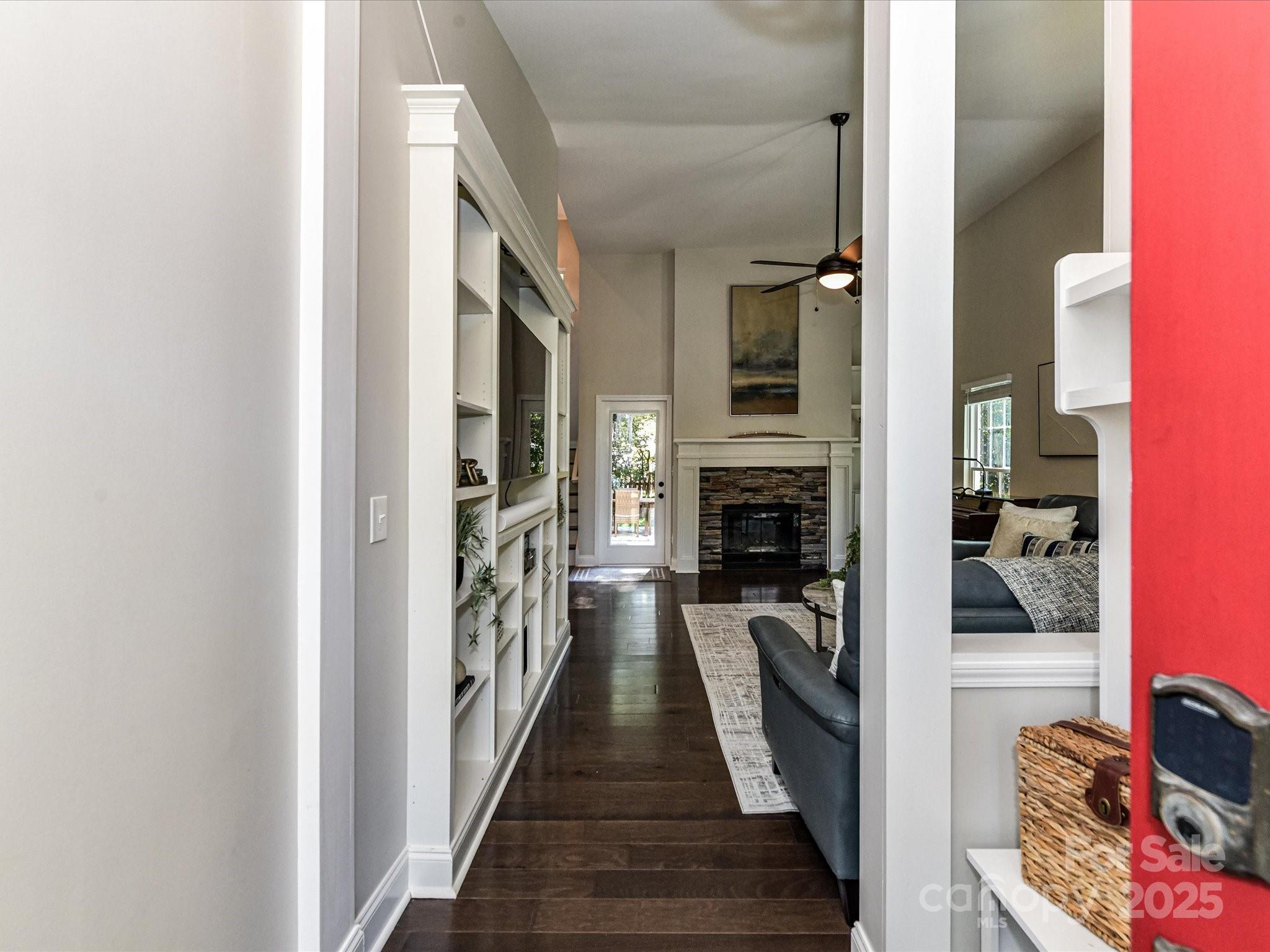 129 Shorecrest Drive Davidson, NC 28036 - Photo 4 of 45 a view of a hallway with wooden floor and a living room