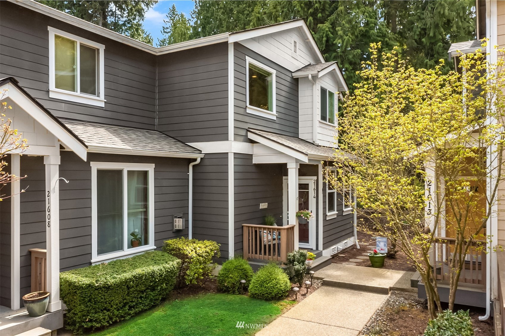 21614 11th Drive Southeast Bothell, WA 98021 - Photo 1 of 35 a front view of a house with garden