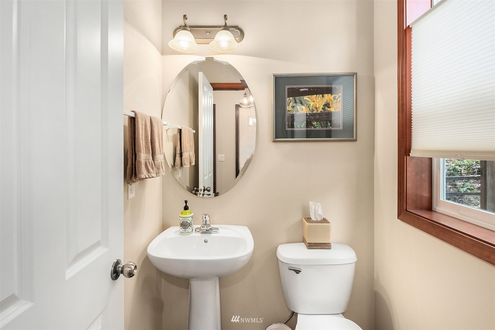21614 11th Drive Southeast Bothell, WA 98021 - Photo 12 of 35 a bathroom with a sink and mirror with toilet