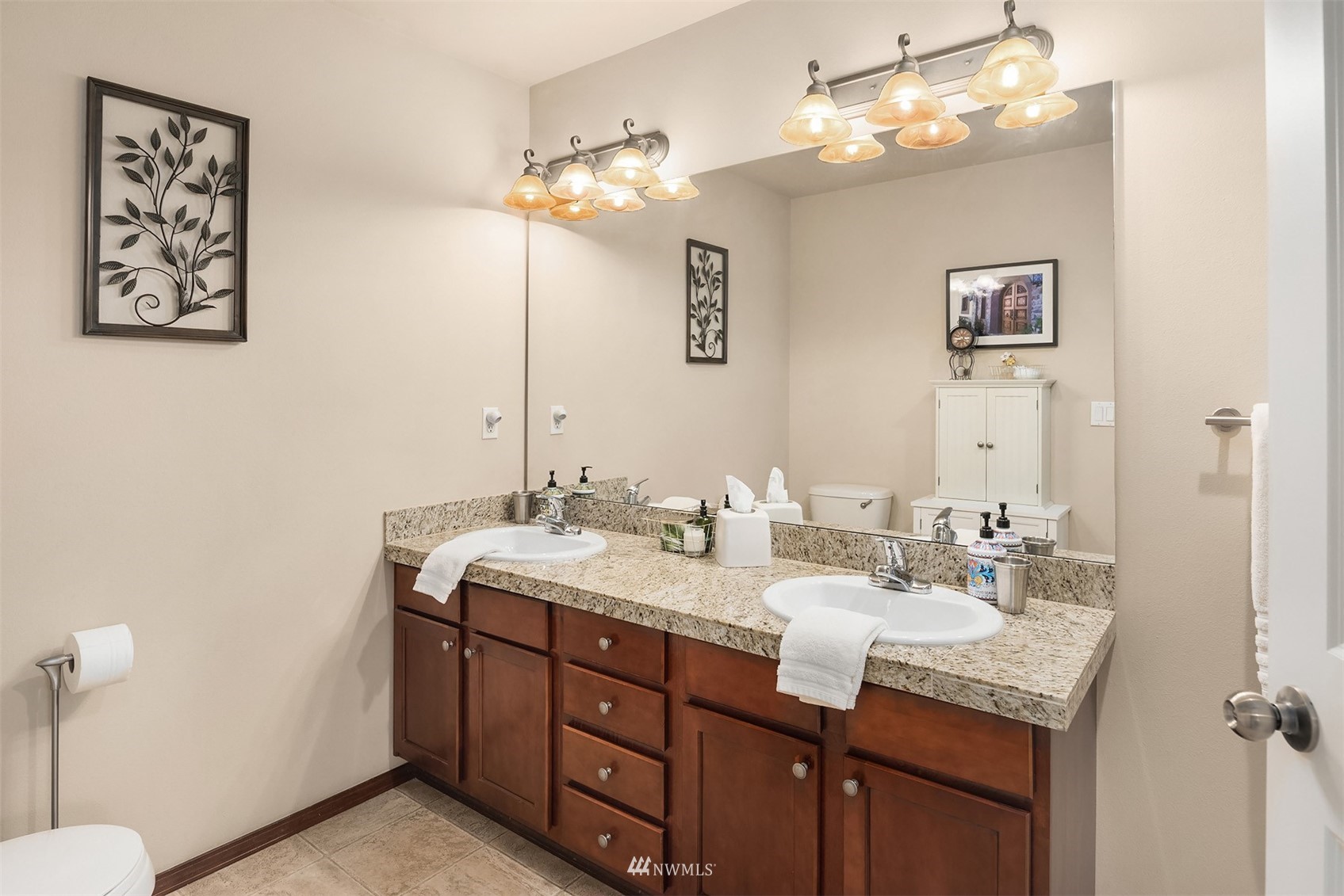 21614 11th Drive Southeast Bothell, WA 98021 - Photo 17 of 35 a bathroom with a sink double vanity and a mirror