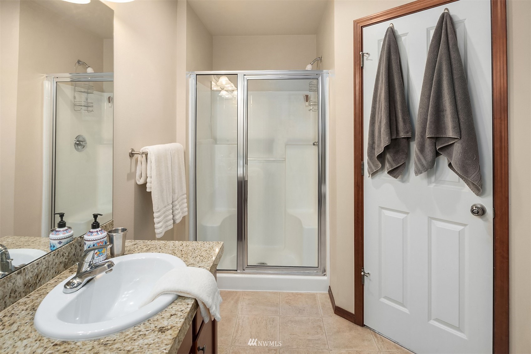 21614 11th Drive Southeast Bothell, WA 98021 - Photo 18 of 35 a bathroom with a tub sink and mirror