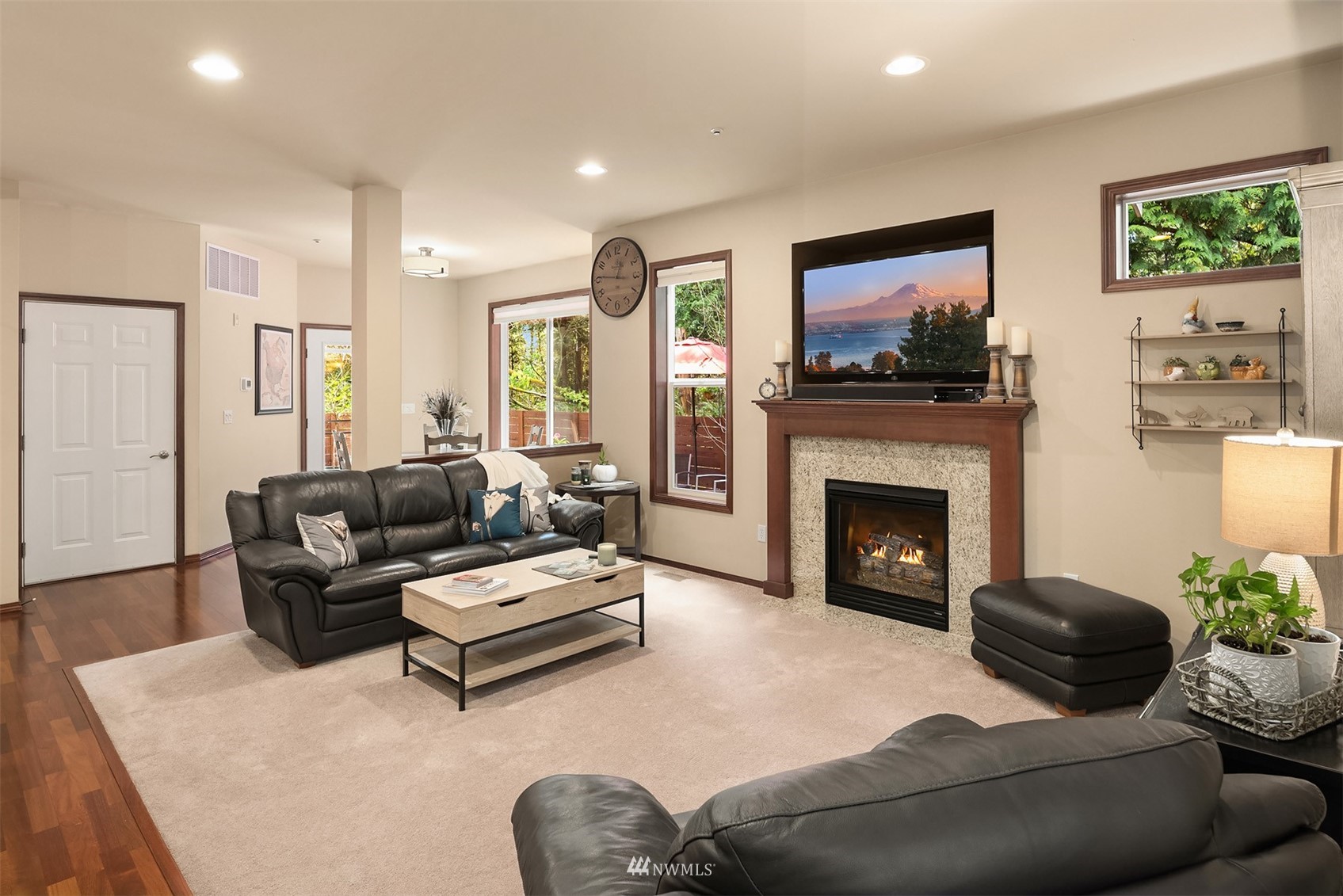 21614 11th Drive Southeast Bothell, WA 98021 - Photo 2 of 35 a living room with furniture a flat screen tv and a fireplace