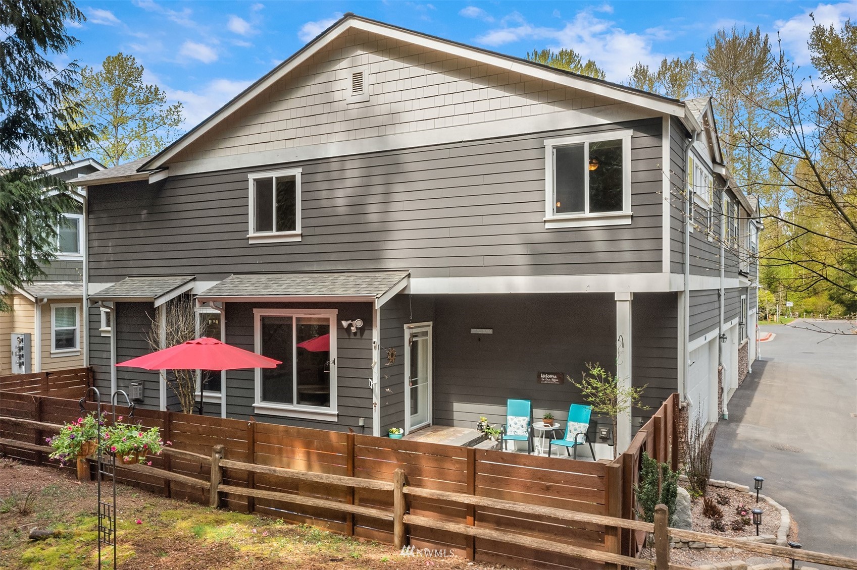 21614 11th Drive Southeast Bothell, WA 98021 - Photo 27 of 35 a patio with a table and chairs under an umbrella