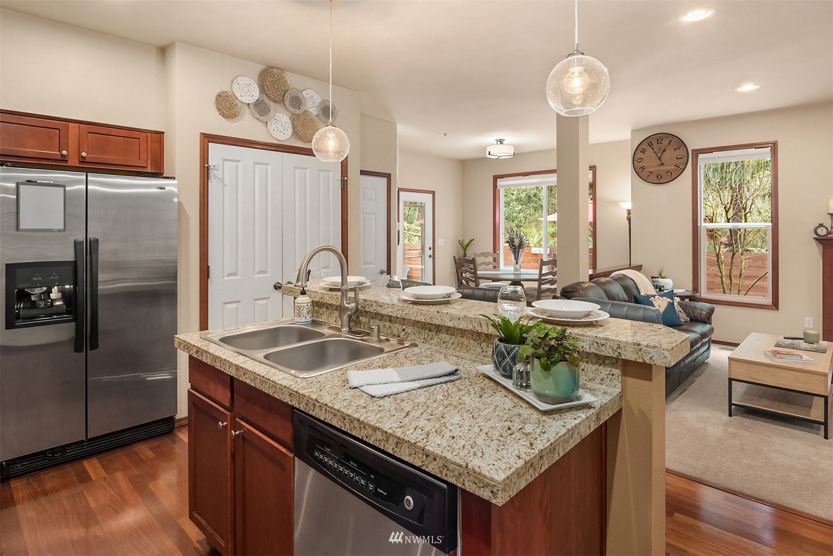 21614 11th Drive Southeast Bothell, WA 98021 - Photo 8 of 35 a kitchen with kitchen island granite countertop a sink and a refrigerator