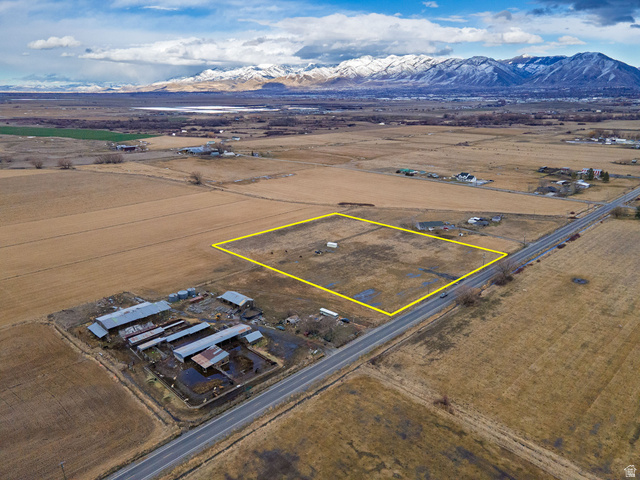 3285 West 600 South Logan, UT 84321 - Photo 6 of 16 Aerial view of sparsely populated area featuring mountains and property boundaries highlighted