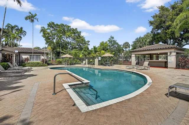 a view of a swimming pool with a lounge chairs