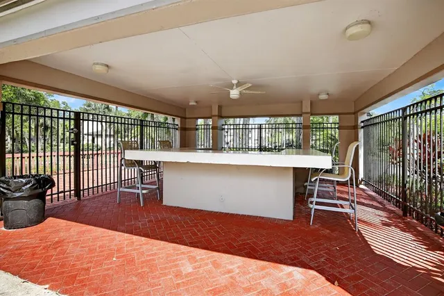 a bedroom with a large window and furniture