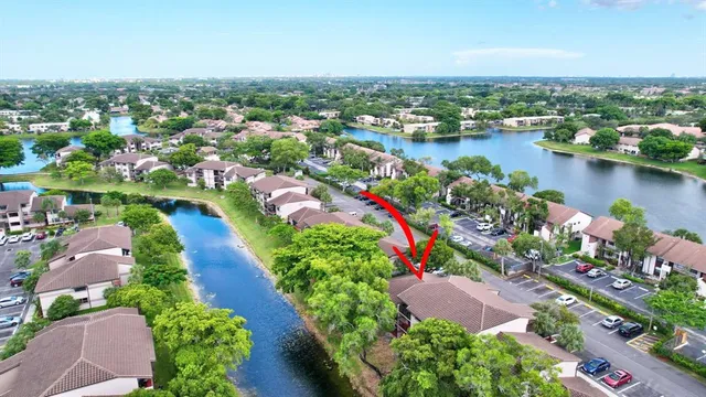 an aerial view of city lake and houses with outdoor space