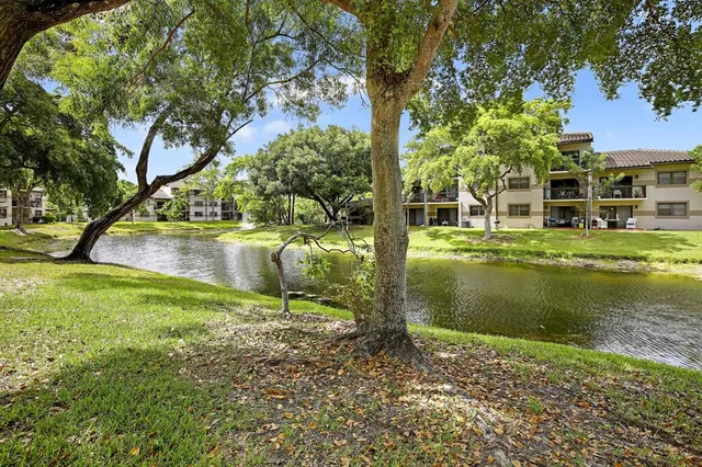a view of a lake with a building in the background