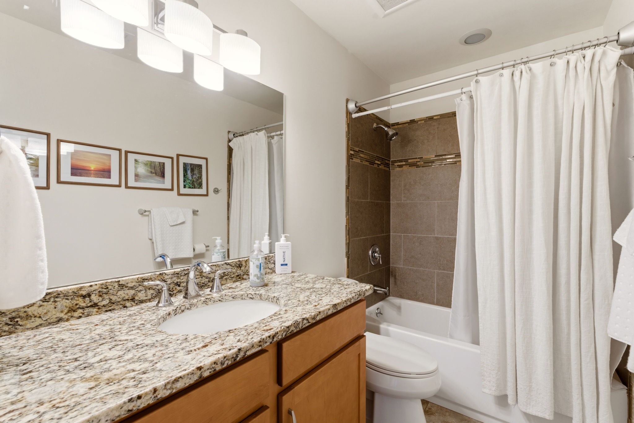 3 Silver Buckle Road Santa Fe, NM 87508 - Photo 26 of 34 Guest bath tiled with barn doors