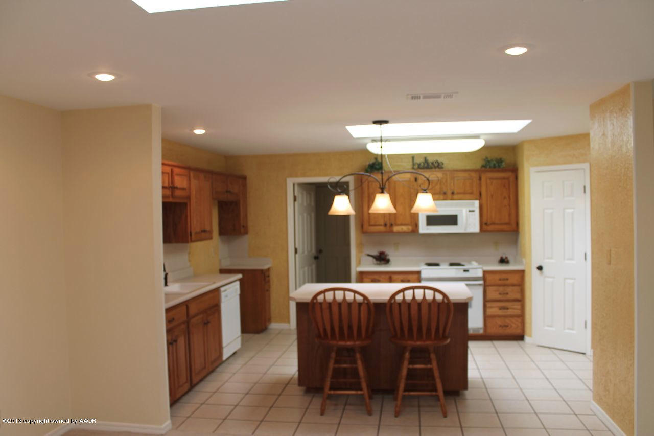 7002 Learning Tree Avenue Amarillo, TX 79119 - Photo 8 of 26 From Dining to Kitchen