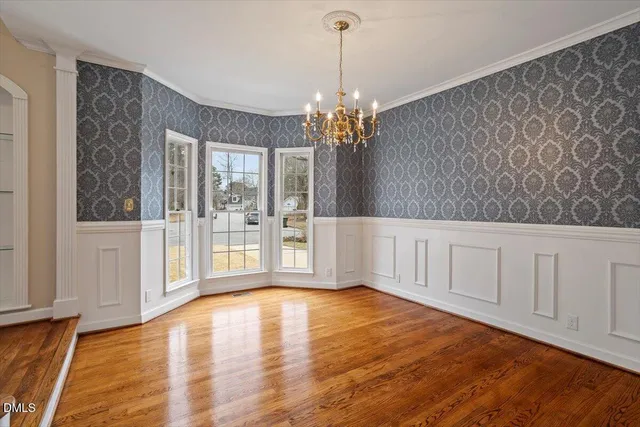a view of room with window and hardwood floor