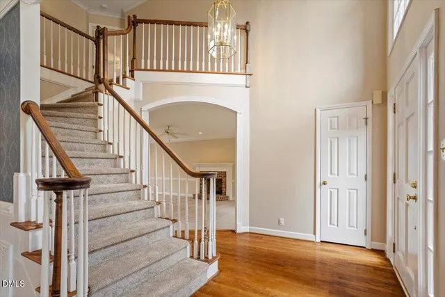 a bathroom with double vanity a toilet a sink and a mirror