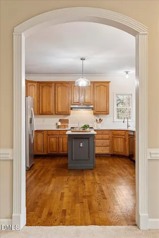a bathroom with a sink a mirror and a shower