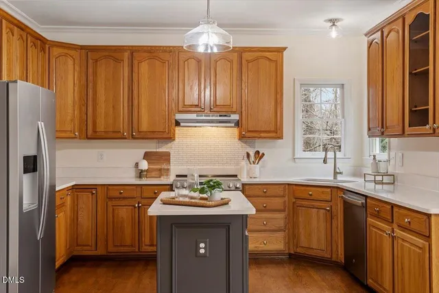 a view of a yard with plants and trees