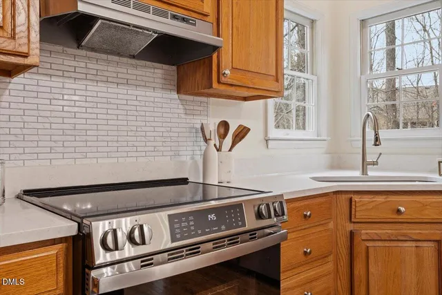 a view of balcony with wooden floor and fence