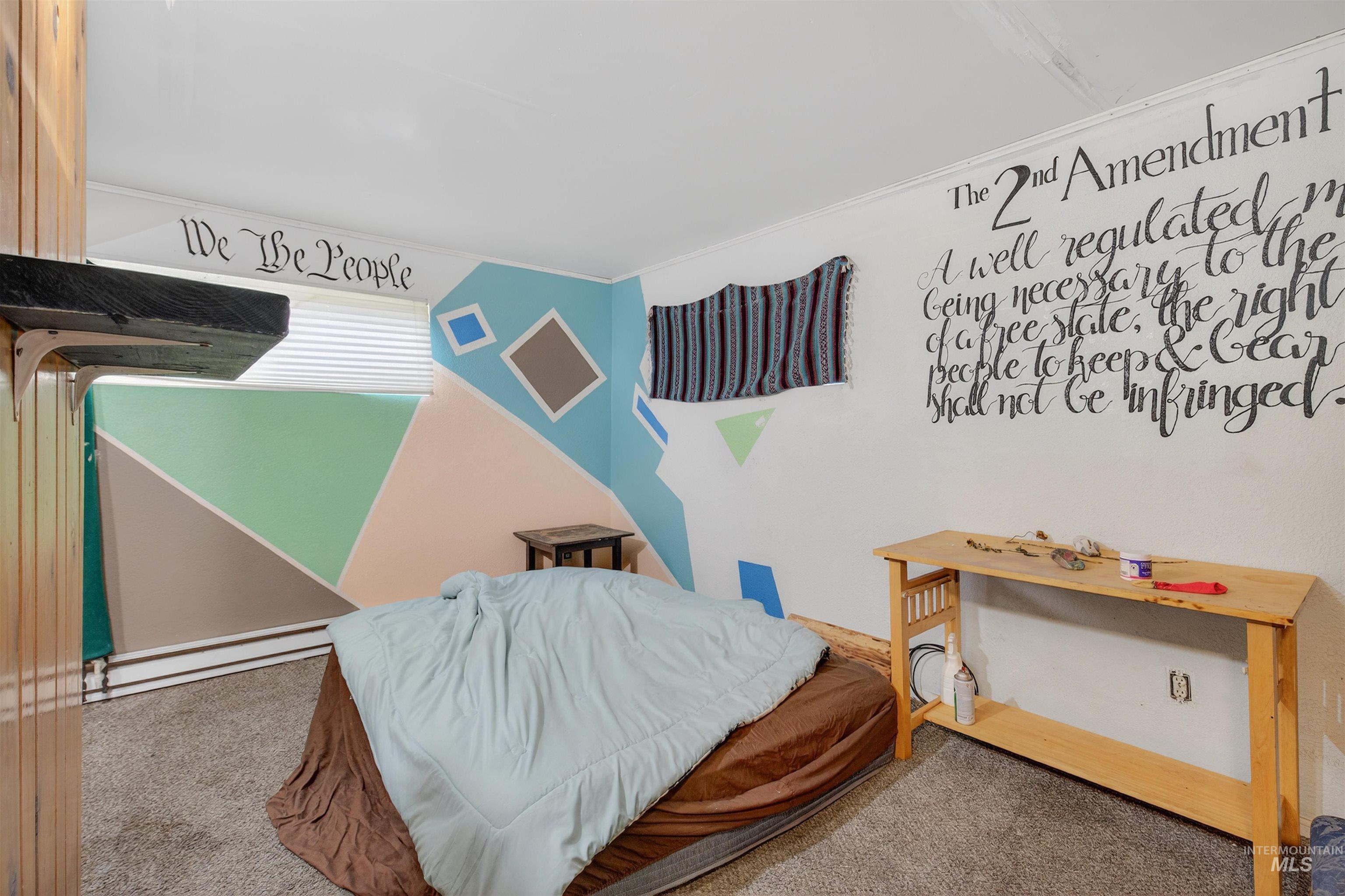 307 Esther Street Kooskia, ID 83539 - Photo 17 of 37 Carpeted bedroom with ornamental molding