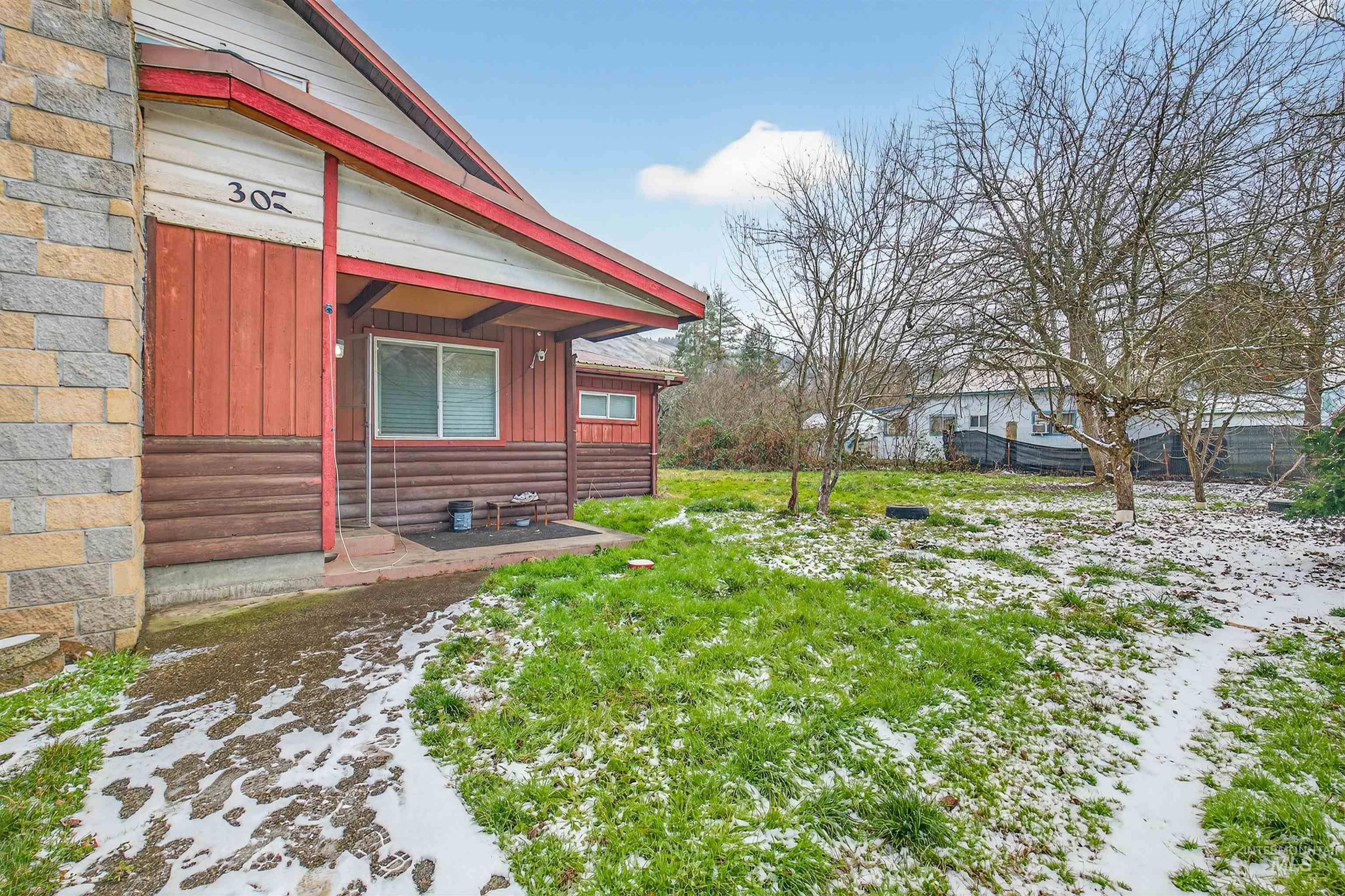 307 Esther Street Kooskia, ID 83539 - Photo 24 of 37 View of snow covered exterior with board and batten siding
