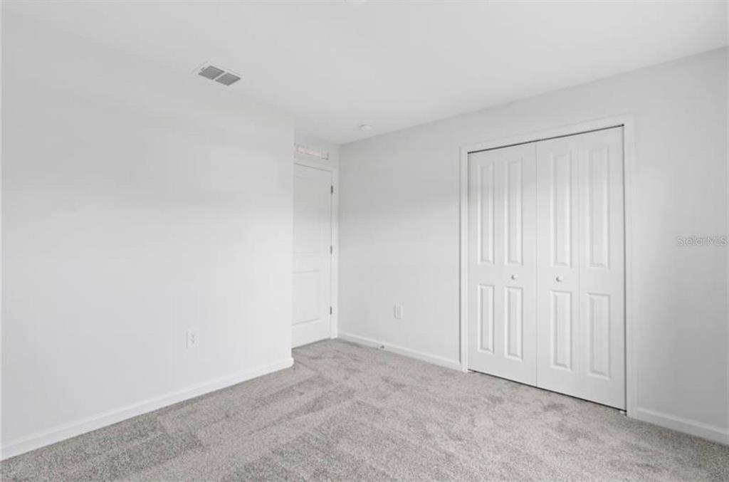 352 Heroic Road Davenport, FL 33837 - Photo 11 of 19 a view of an empty room