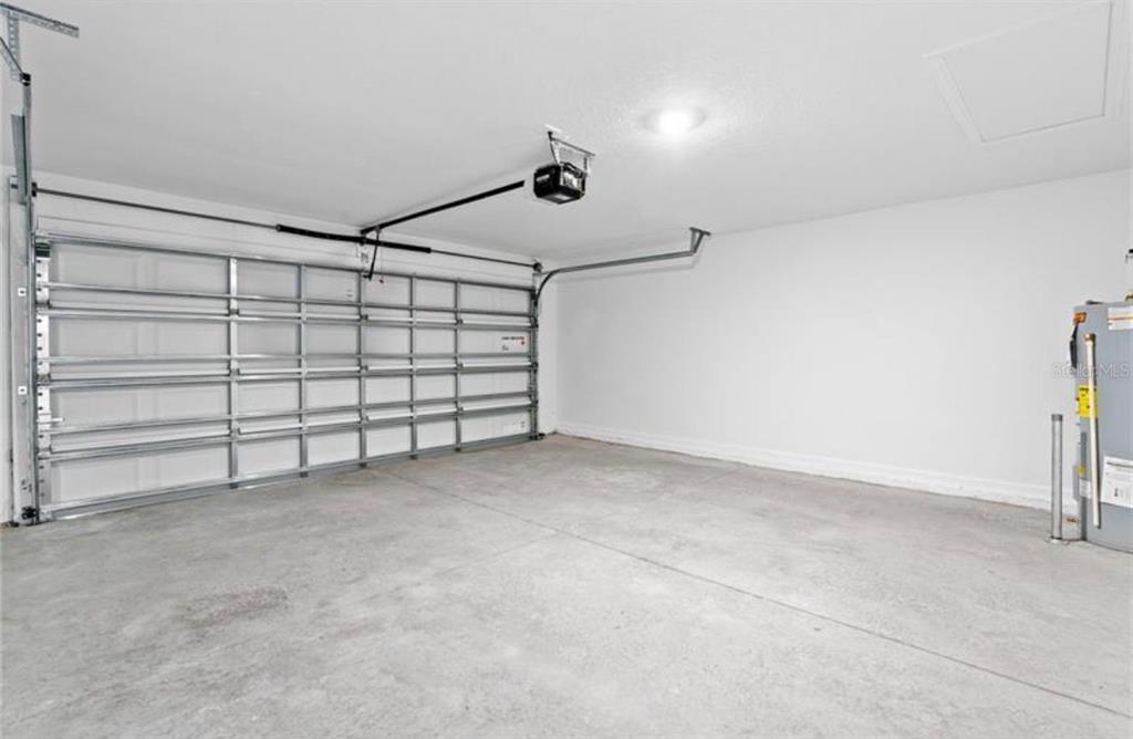 352 Heroic Road Davenport, FL 33837 - Photo 16 of 19 a view of a garage