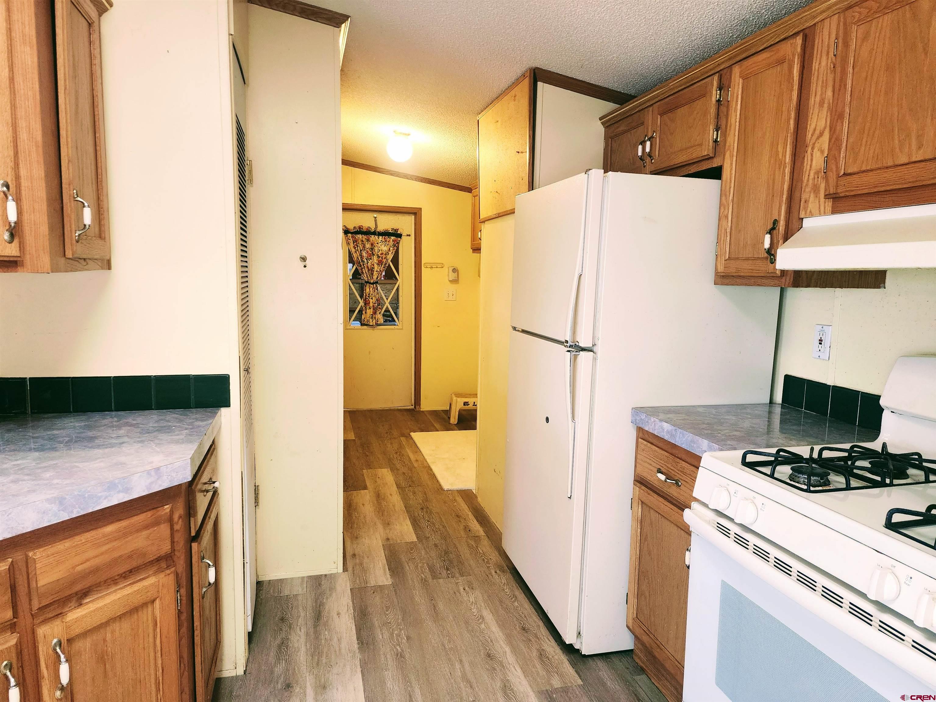 20897 Iris Road Austin, CO 81410 - Photo 15 of 29 a view of kitchen and wooden floor