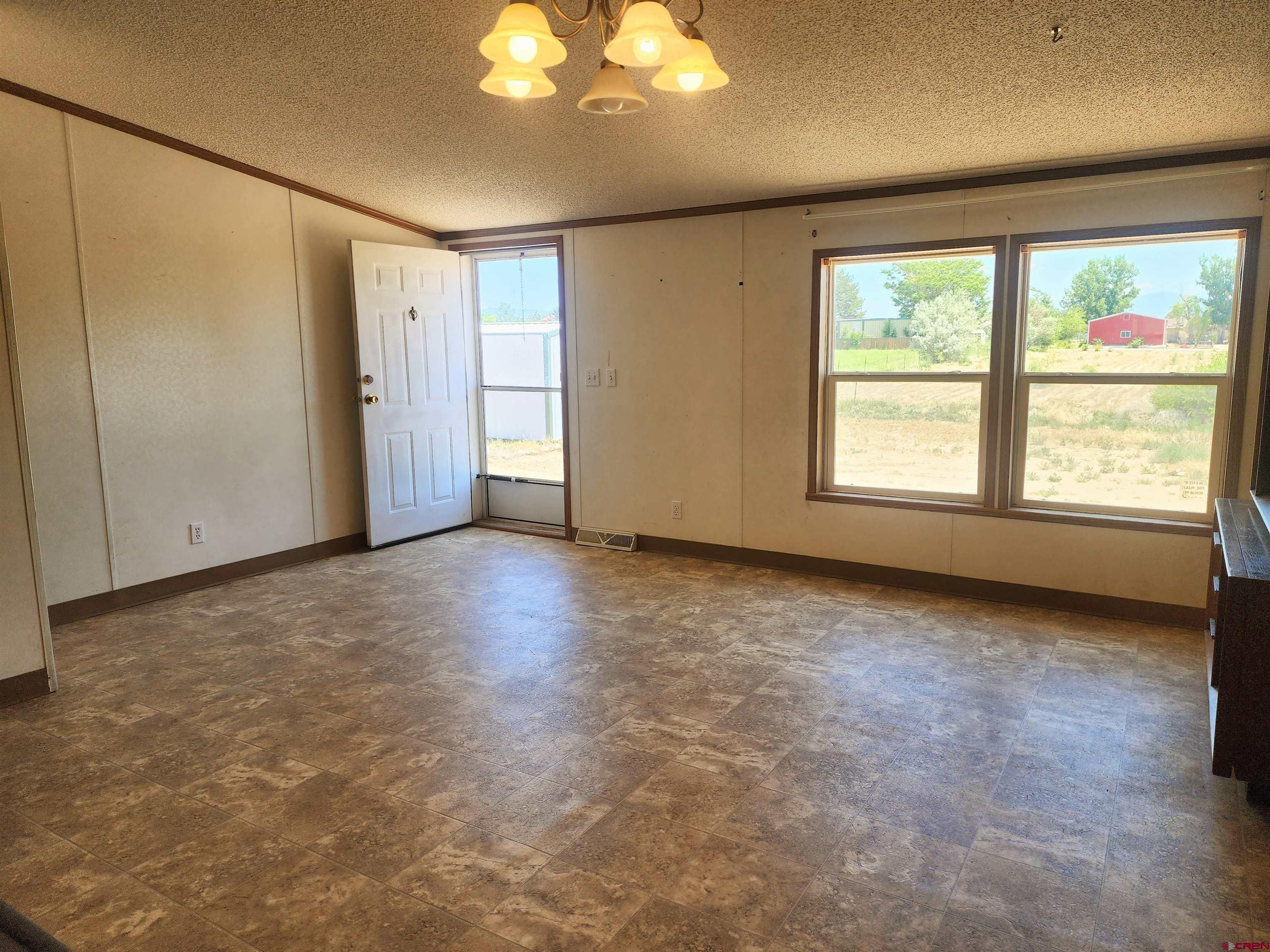 20897 Iris Road Austin, CO 81410 - Photo 18 of 29 an empty room with windows and closet