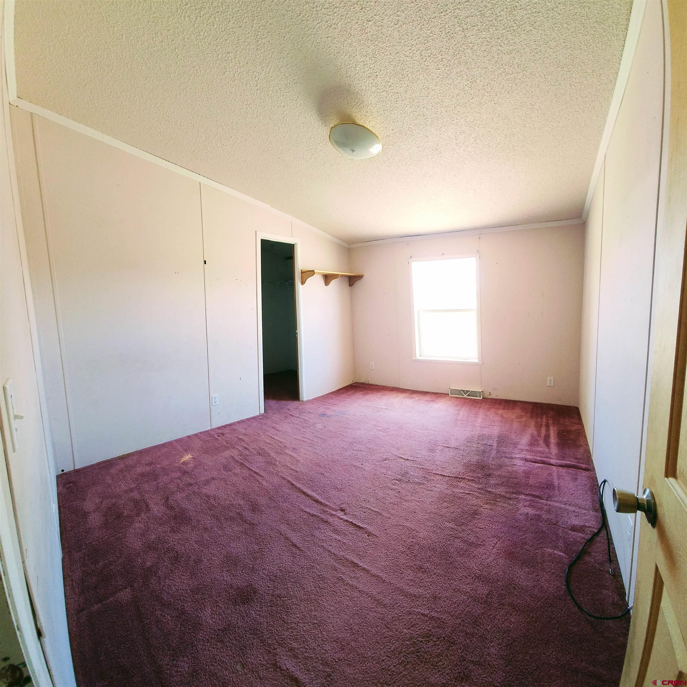 20897 Iris Road Austin, CO 81410 - Photo 22 of 29 a view of empty room with window