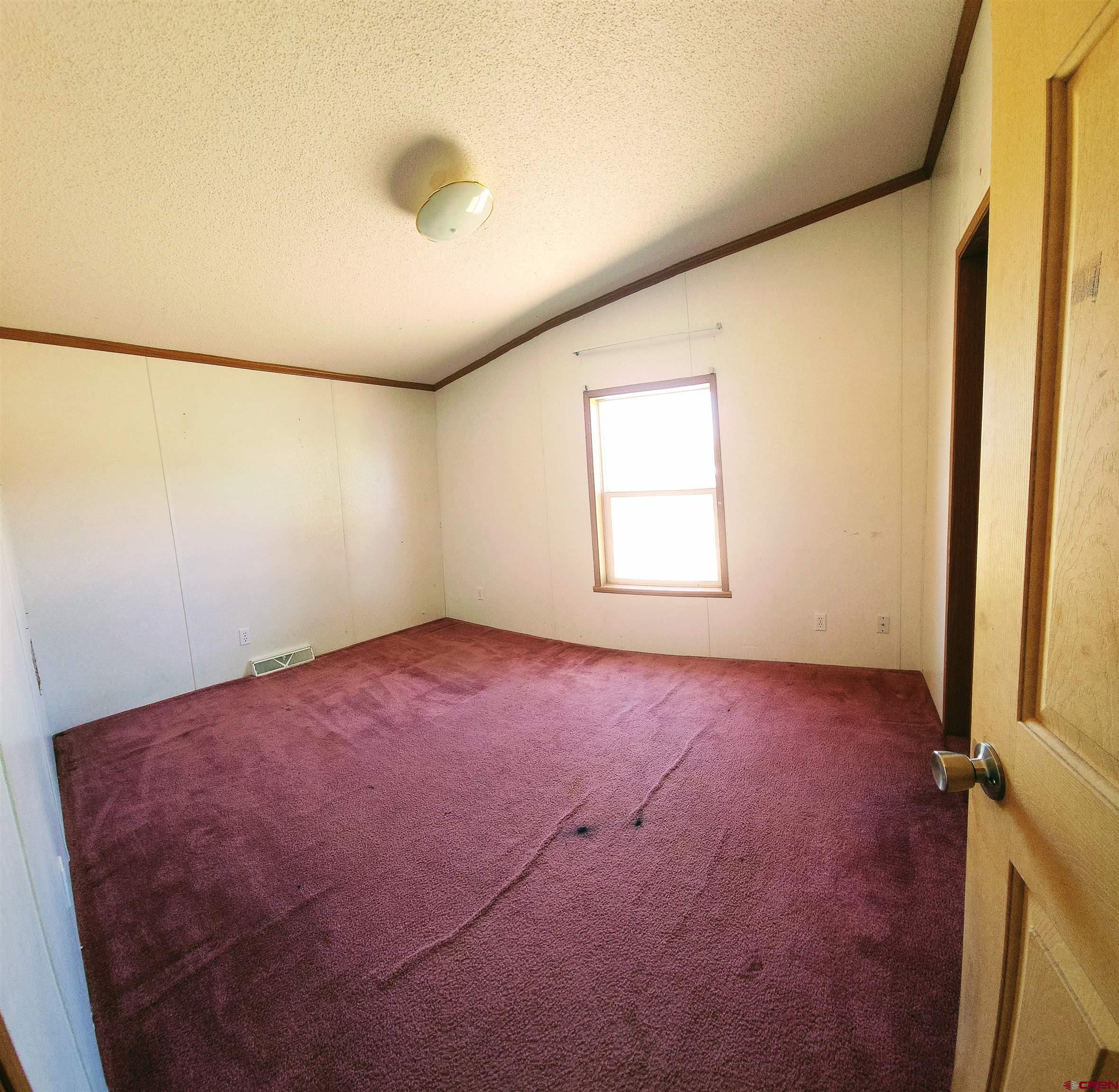 20897 Iris Road Austin, CO 81410 - Photo 23 of 29 an empty room with windows