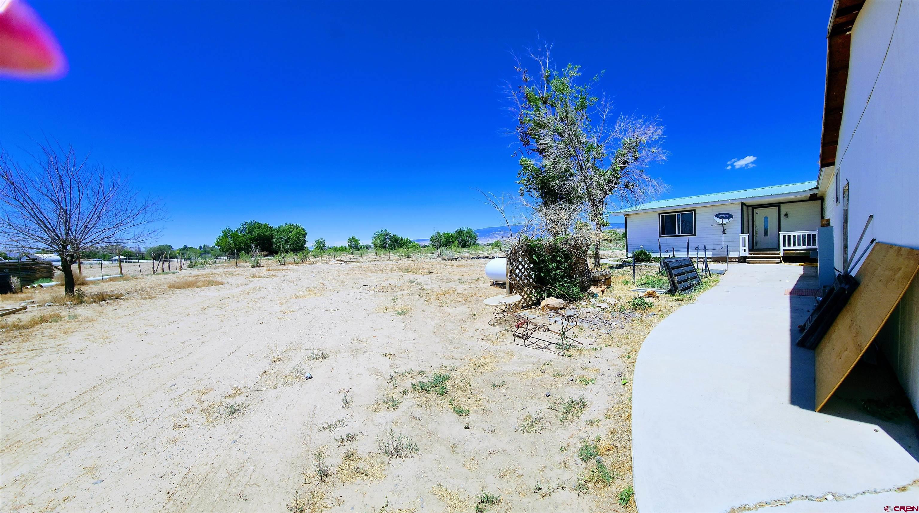 20897 Iris Road Austin, CO 81410 - Photo 26 of 29 a view of a house with a patio
