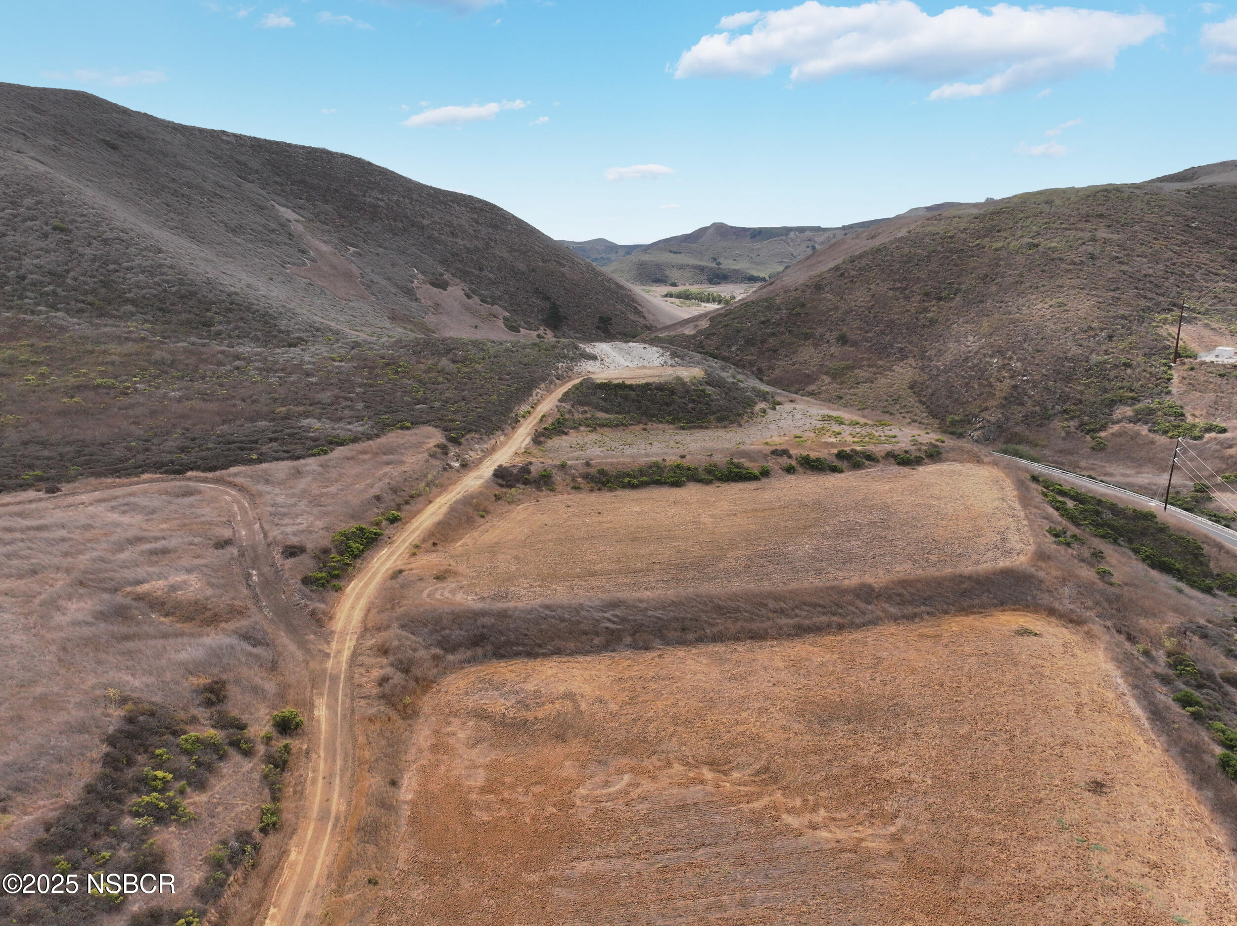 100 Highway 1 Lompoc, CA 93436 - Photo 13 of 37 a view of a dry yard with mountains in the background