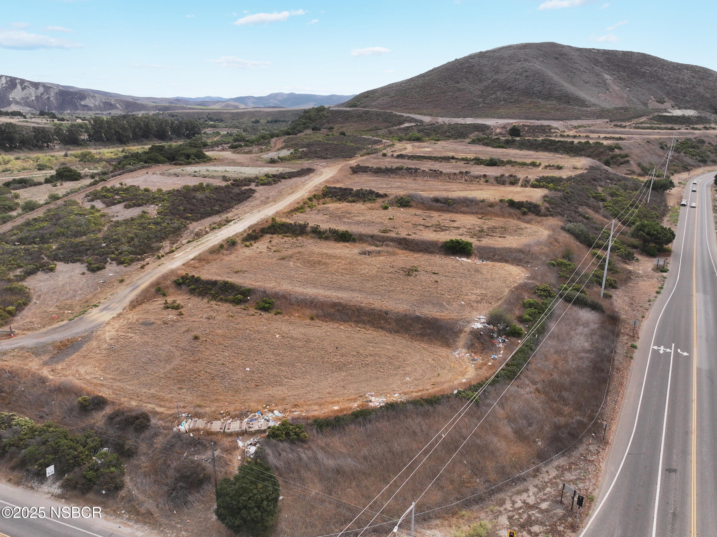 100 Highway 1 Lompoc, CA 93436 - Photo 9 of 37 a view of a dry yard with wooden fence