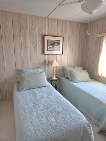 a bedroom with double bed and a window