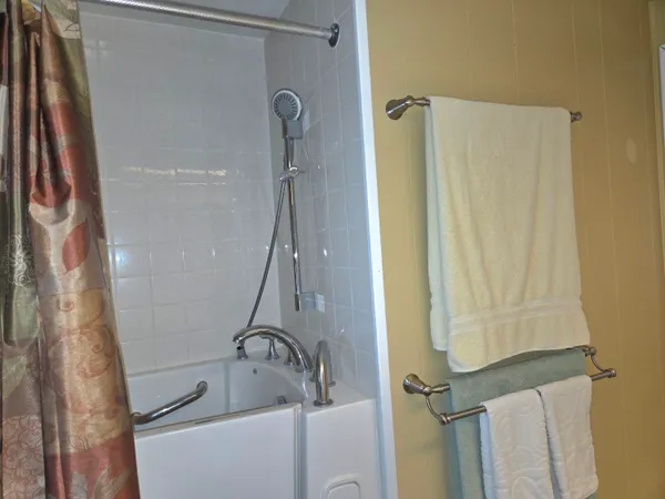 a bathroom with a shower and a sink