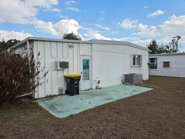 a view of a swimming pool with seating area